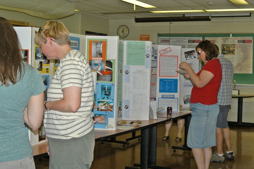 Visitors to the open house at the University of Guelph Central Animal Facility learn about research and environmental enrichment over lunch. Credit: Janet Gugan