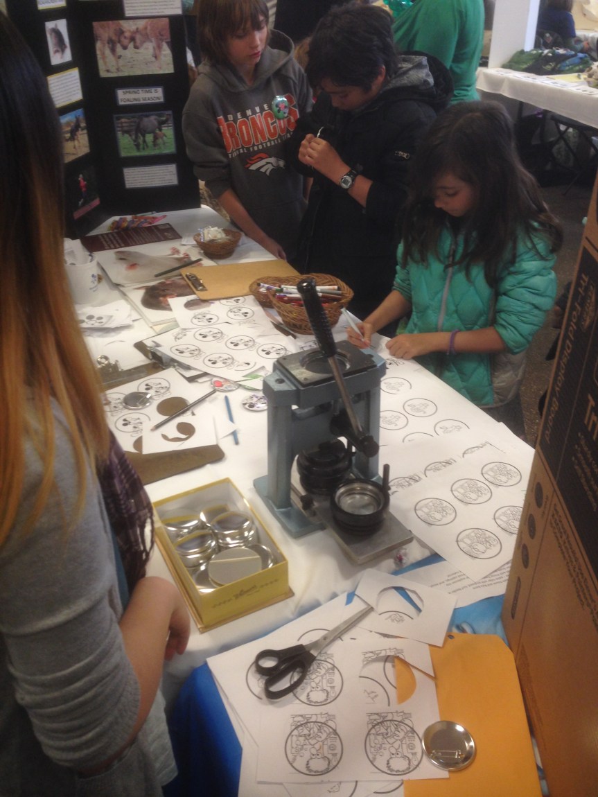 Colorado State University gave kids laboratory animal coloring sheets and used a button machine to make their creations into buttons to be worn throughout the day. It was a hit!