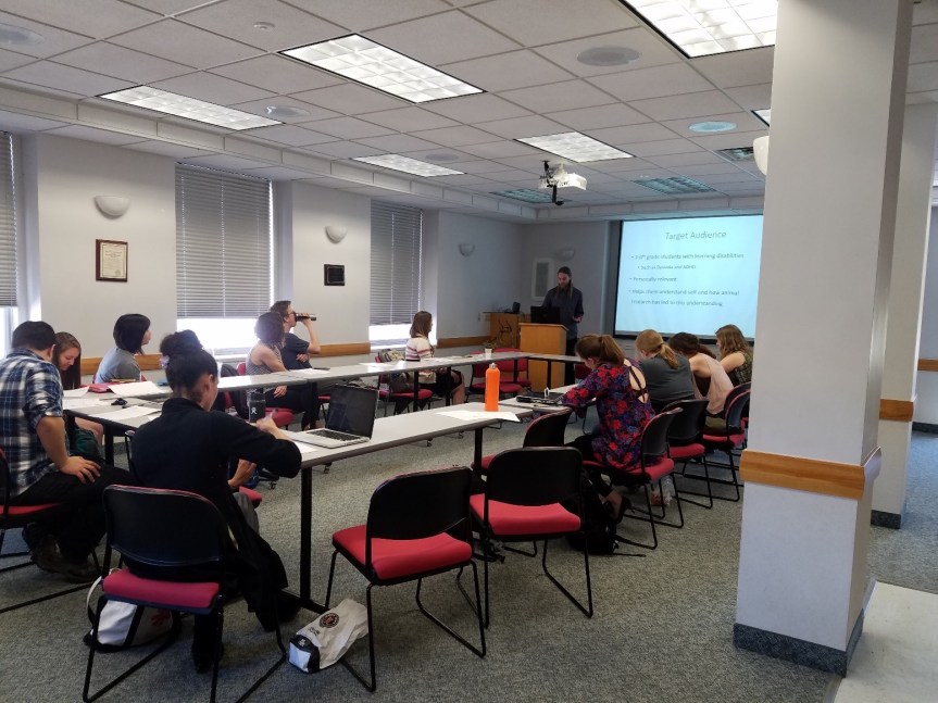 During the final seminar period, students presented their outreach proposals to the class.